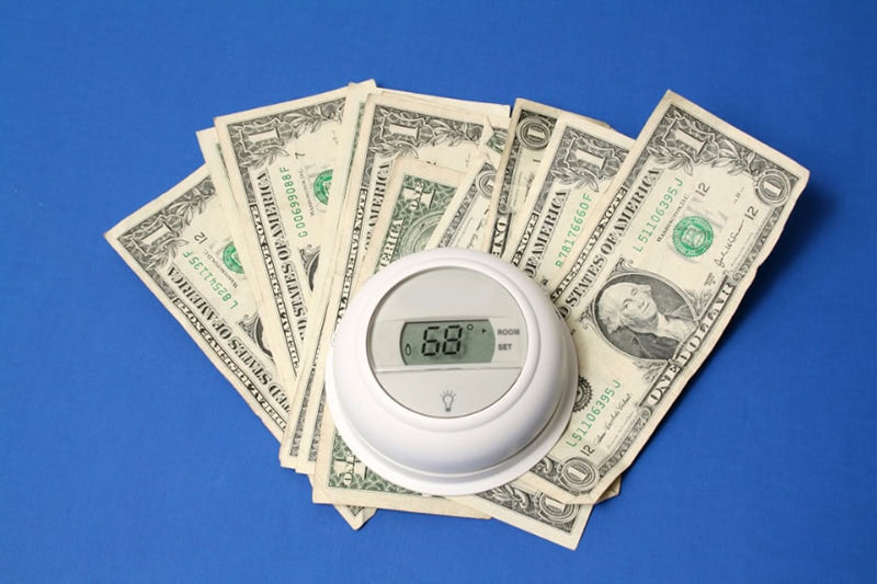 Summer Savings Tips for AC. Money with a themostat.