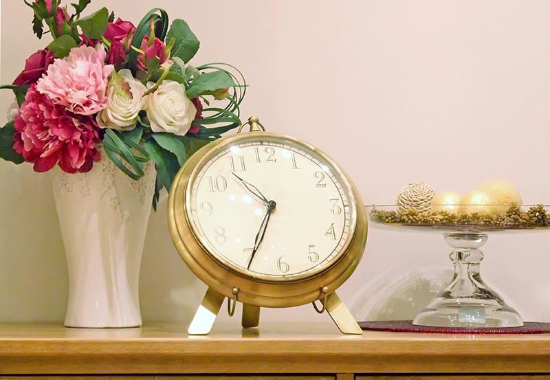 An elegant tabletop arrangement set on a wooden surface.