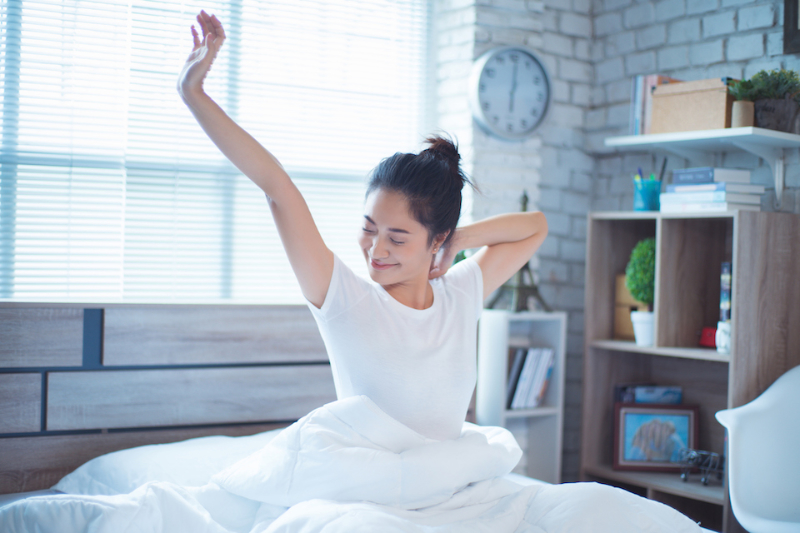 Asian women She is in bed and was waking up in the morning. She felt very refreshed. Asian women She is in bed and was waking up in the morning. She felt very refreshed.