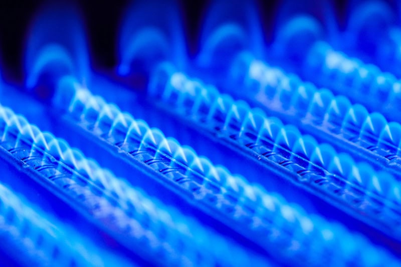 How Does My Furnace Affect My Home’s Indoor Air Quality? Close up photo of furnace coils in a blue hue.